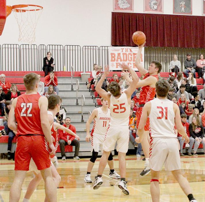 Trey Appelt shoots over the top of a Valentine player in Ainsworth defeat of the Valentine Badgers. Appelt had 13 rebounds against the Badgers.