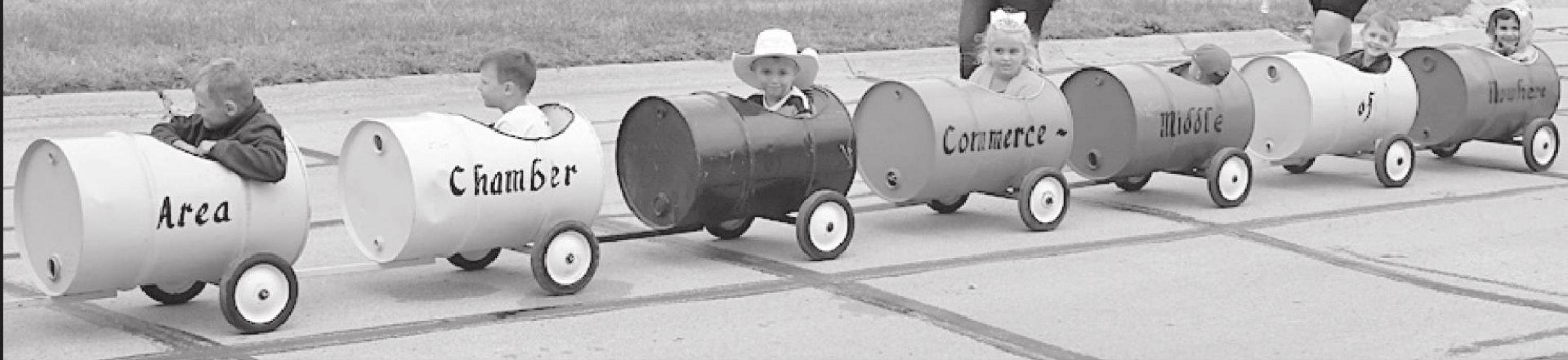 Little Miss Dailey and Little Mr. Dailey Ride in Chamber of Commerce Float