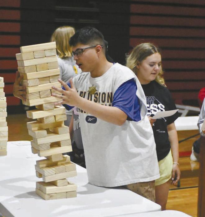 Colby Beegle plays giant Jenga at post prom.