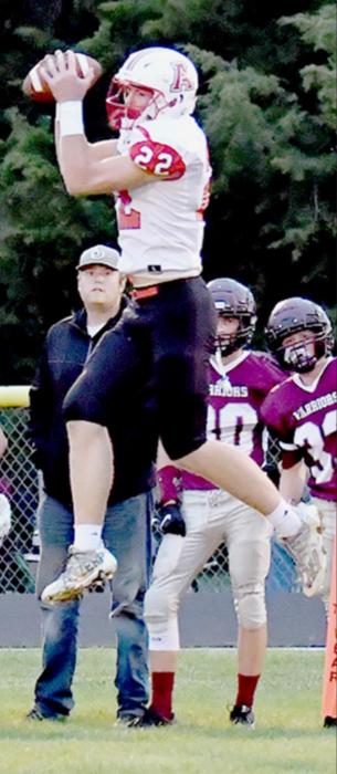 Nelson goes up for a pass early in the first quarter against Neligh-Oakdale. Nelson had seven receptions for 77 yards.