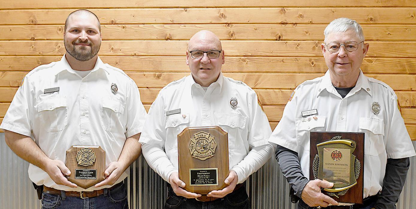 Honored for years of service to the Ainsworth Fire and Rescue were firemen (left to right) Cameron Koch - 15 years, Brand Fiala - 40 years and Randy Johnson - 45 year. Honored, but not present, were Austin Cook - 15 years and Trent Kinney - 10 years.