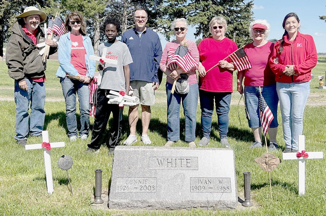 Other volunteers converged on the cemetery to put crosses, small flags and Legion and Auxiliary grave markers on graves. Some of the volunteers participating were (Left to Right) Nick Krause, Joni Kozisek, Keith Munnu, Scott Steinhauser, Lila DeRaad, Marilyn Anderson, Shari Luther and Madonna Coutts. Charlie Kyser and Sunny Kyser decorated the Ainsworth East Cemetery with flags, small crosses along with Legion and Auxiliary grave markers on graves.