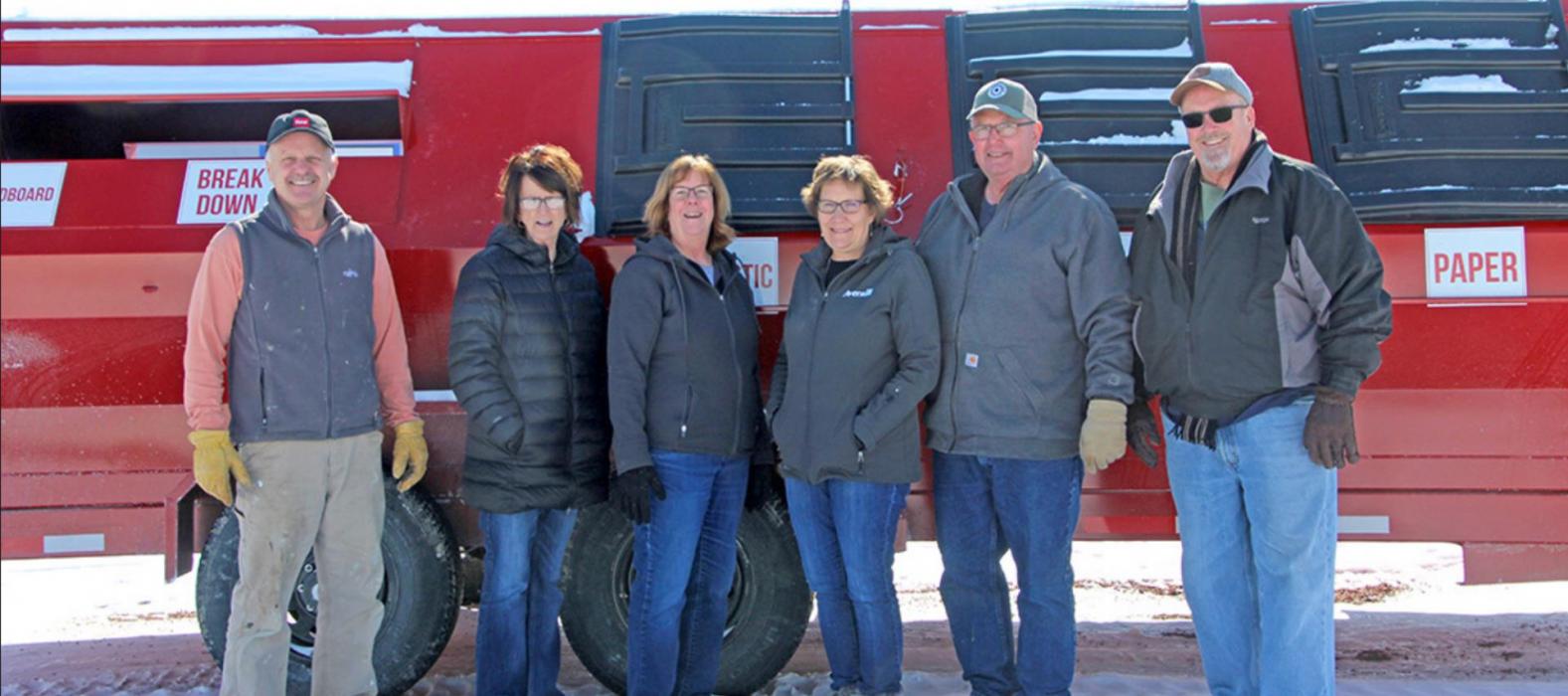 Pictured in front of the new recycling trailer are, l to r, Mayor Scott Anshutz, City Council member Guyla Husman, and recycling committee members Cheryl Duimstra, Terri and Blane Bartling, and Gregg Drees.
