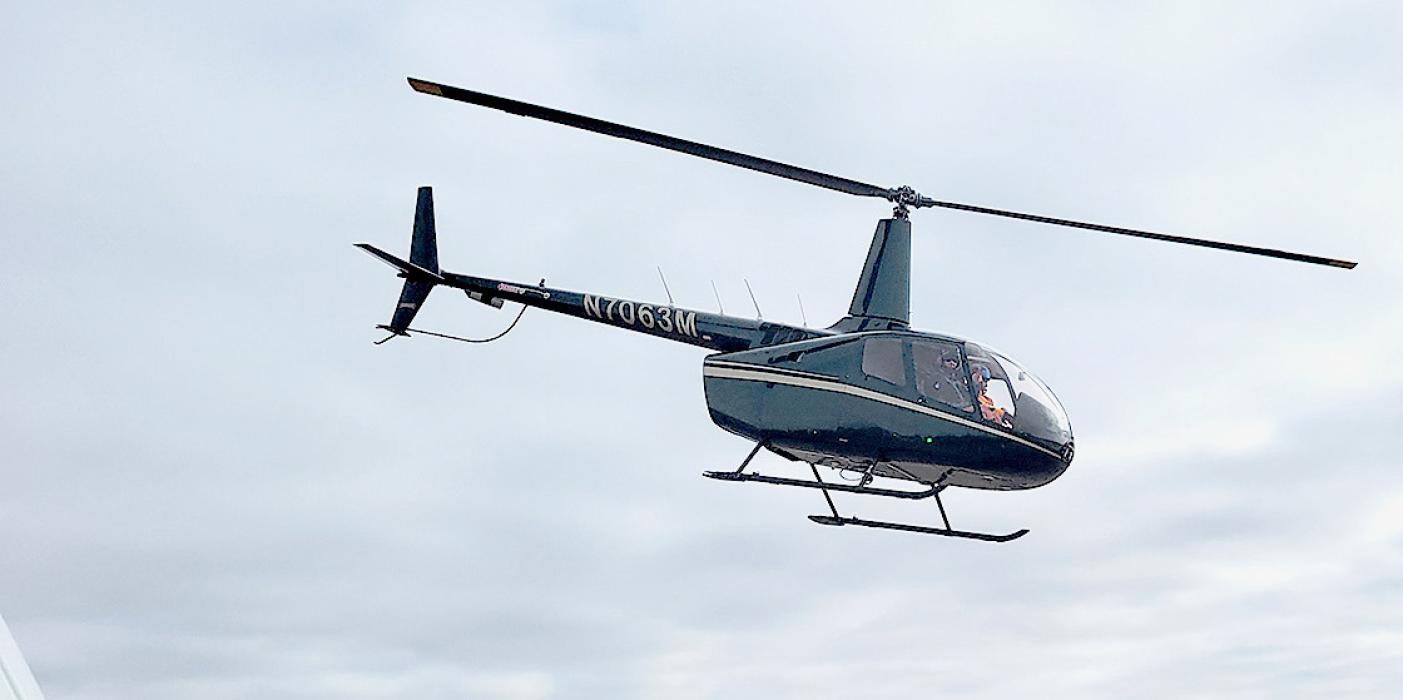 Helicopter searches canyons for elk. Photo by Kelly Corman
