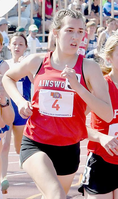 Junior Katherine Kerrigan competed in the 3200 Meter Run, 1600 Meter Run and 4x800 Meter Relay. She placed seventh in the 3200 and eighth as part of the 4x800 Relay team. Photos by Debb Gracey and Rod Worrell