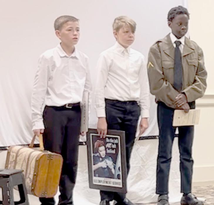 Max Hasenohr (left), Paul Denny (center) and Keith Munnu (right) giving their performance at the national competition.