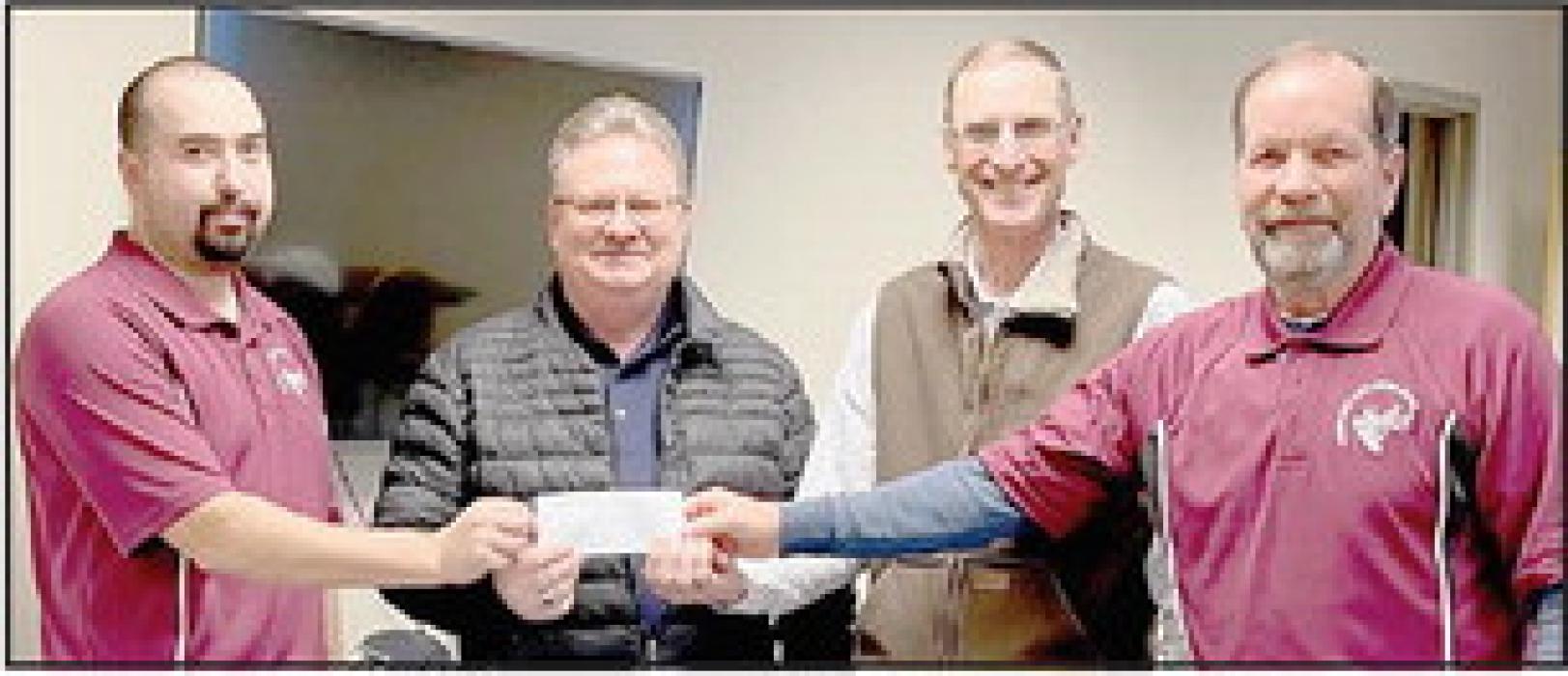 Ainsworth Elks Lodge represented by Exaulted Ruler Heath Rudnick (Left) and Secretary Bill Carr (Right), presented a $6,000.00 check to Russell Thayer (Second from Left) and Gary Graesser (Second from Right) for the Ainsworth Ministerial Alliance.
