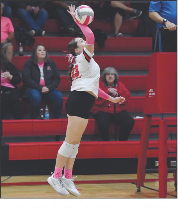 Freshman Payton Sears attacks a ball set by teammate Willa Flynn.