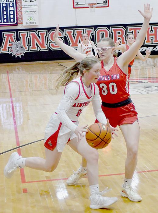 Kenley Welke works the baseline against Janae Marten. Welke scored six points for Ainsworth.