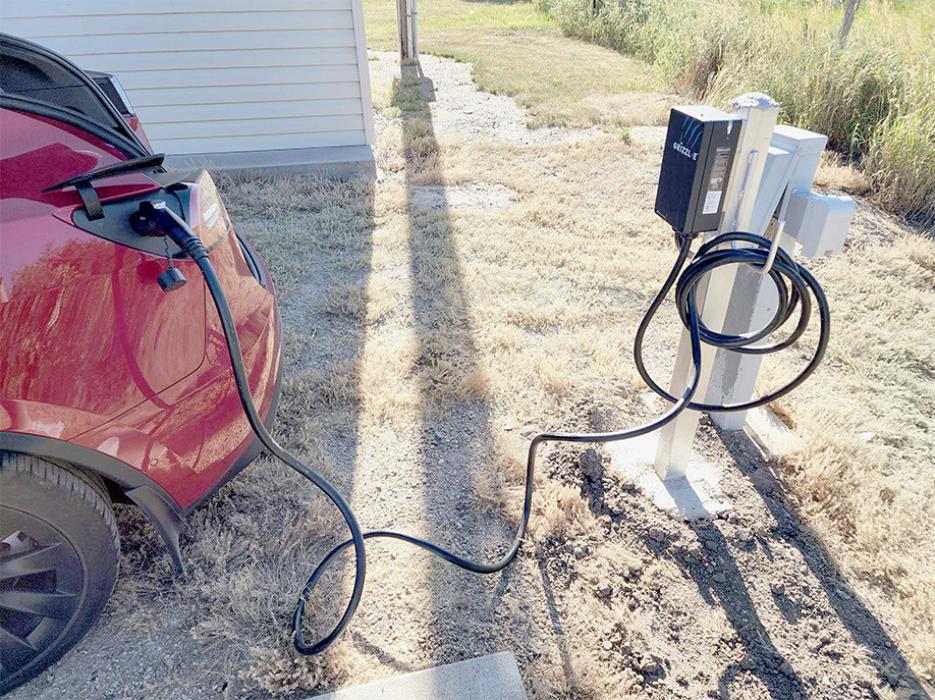 A car stops by to charge up with the new electrical vehicle charger at Rodeway Inn. It is located behind the hotel for guests to use at a price of $15.00 a charge.