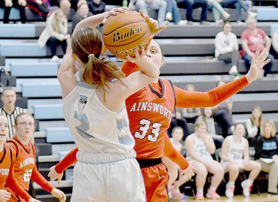Karli Kral got a hand on the ball to deflect a shot in the third quarter against the Summerland Lady Bobcats.