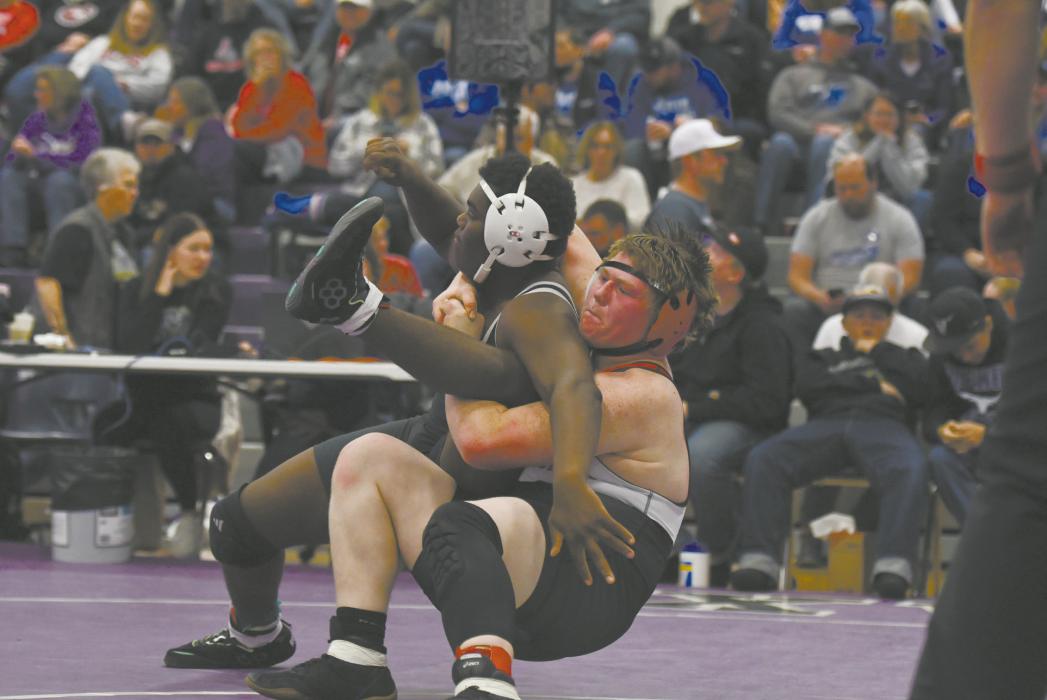 Sophomore John Lewis takes down his opponent. Lewis went 2-2 during the West Holt Invitational.