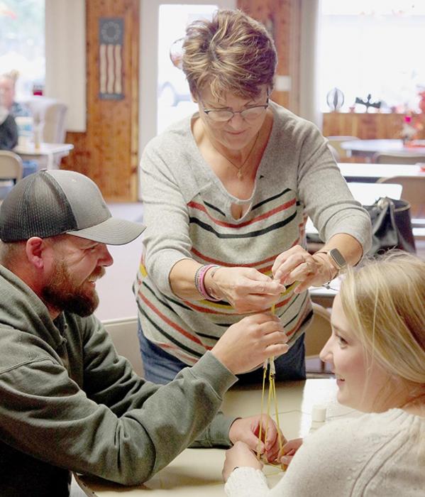 After a full day of education-focused discussion, participants broke into small groups for a team building exercise. Pictured are Jason McNair, Rhonda Ammon and Hailey Walmsley. Photo by Springview Herald