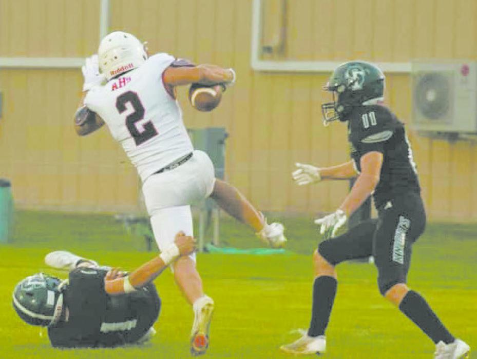 Sophomore Zaine Evans returned to the field after recovering from an injury during the sports drink scrimmage prior to the beginning of the season. Evans attempts to run the ball down the field, avoiding Mason Sutton and Thatcher Teahon of Sandhills-Thedford. Photo Courtesy of Aiden Rowley