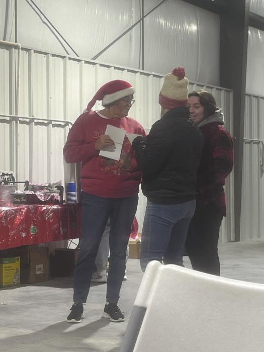 Kathy Worrell (left), a member of the Ainsworth Commercial Club, explains rules of the scavenger hunt to Ellie Conroy and her mother, Angie Welke. Participants picked up scavenger hunt cards from the Ainsworth Fire Department and were treated to hot cocoa, cider, and cookies before starting the scavenger hunt. The night originally called for fireworks, but with high wids, the firework display was cancelled. The winners of this year’s scavenger hunt were Kem Richstein and Cindy Buckles.