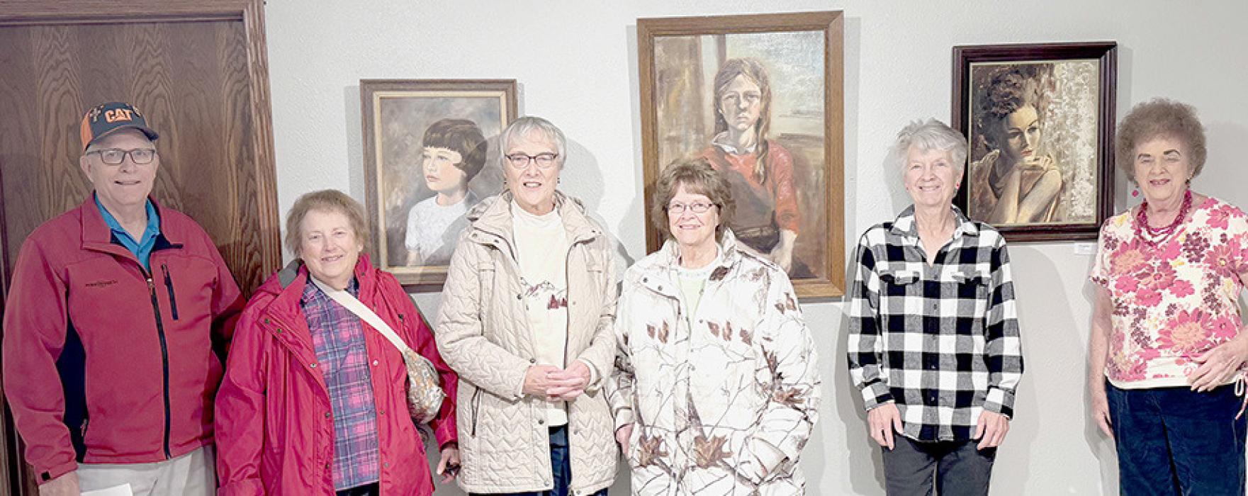 Posing in front of Lucille Hutton’s portrait paintings were members of the Ainsworth Art Guild, (Left to Right) Joe Nelson, Carol Woods, Martha Rasmussen, Audrey Wilson, Lynn Robertson and Pat Nelson.