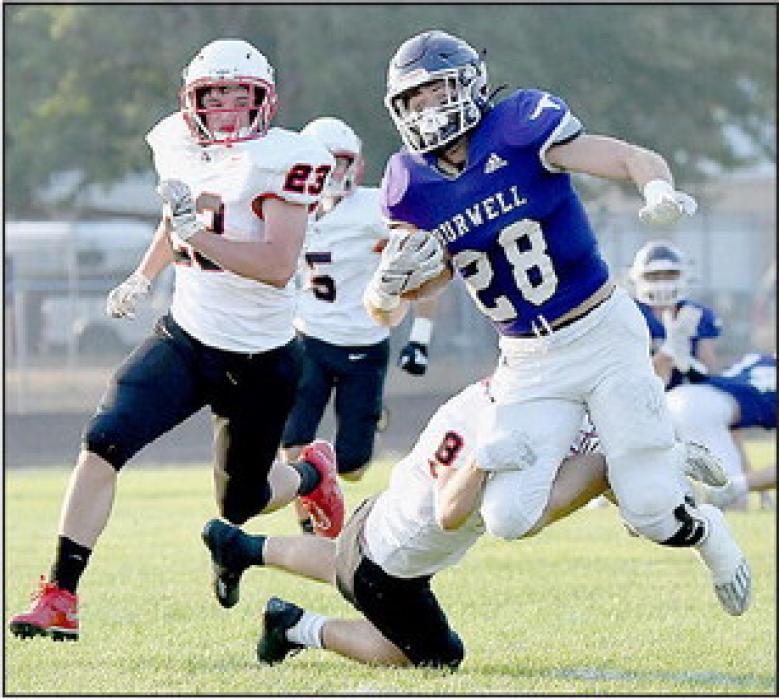 Traegan McNally makes a great open field tackle on Burwell’s Isaac Busch during Burwell’s opening series of plays.