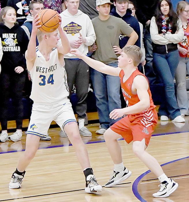 Ainsworth’s Jacob Held at 5’ 6” had the duty of guarding two West Holt players during the game. Ian Larson, #34, is 6’ 5” and Bryce Steinkraus was 6’ 4”. Held did a great job, Larson has eight points and Steinkraus was scoreless.