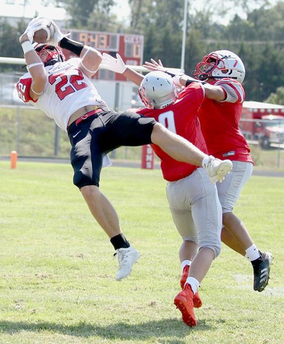 Carter Nelson makes a great catch while falling backward. Nelson caught five passes for 71 yards and one touchdown.
