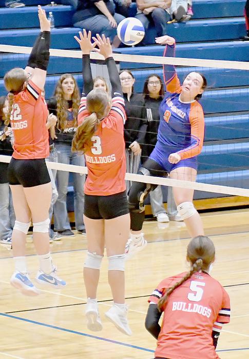 Gracyn Painter (22) and Megan Jones (3) go up for a block against Gordon-Rushville. Ready to assist was Willa Flynn (5).