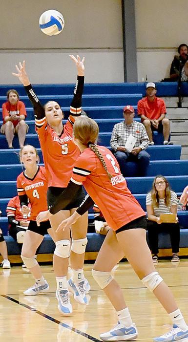 Willa Flynn (5) sets the ball for teammate Jaylee Good (2) during one of their matchups in the Gordon-Rushville triangular.
