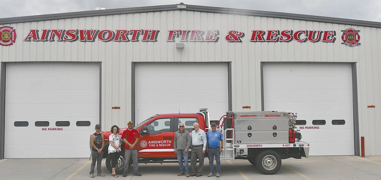 Members of the Ainsworth Fire Department show off the new fire truck, purchased using grant funds.