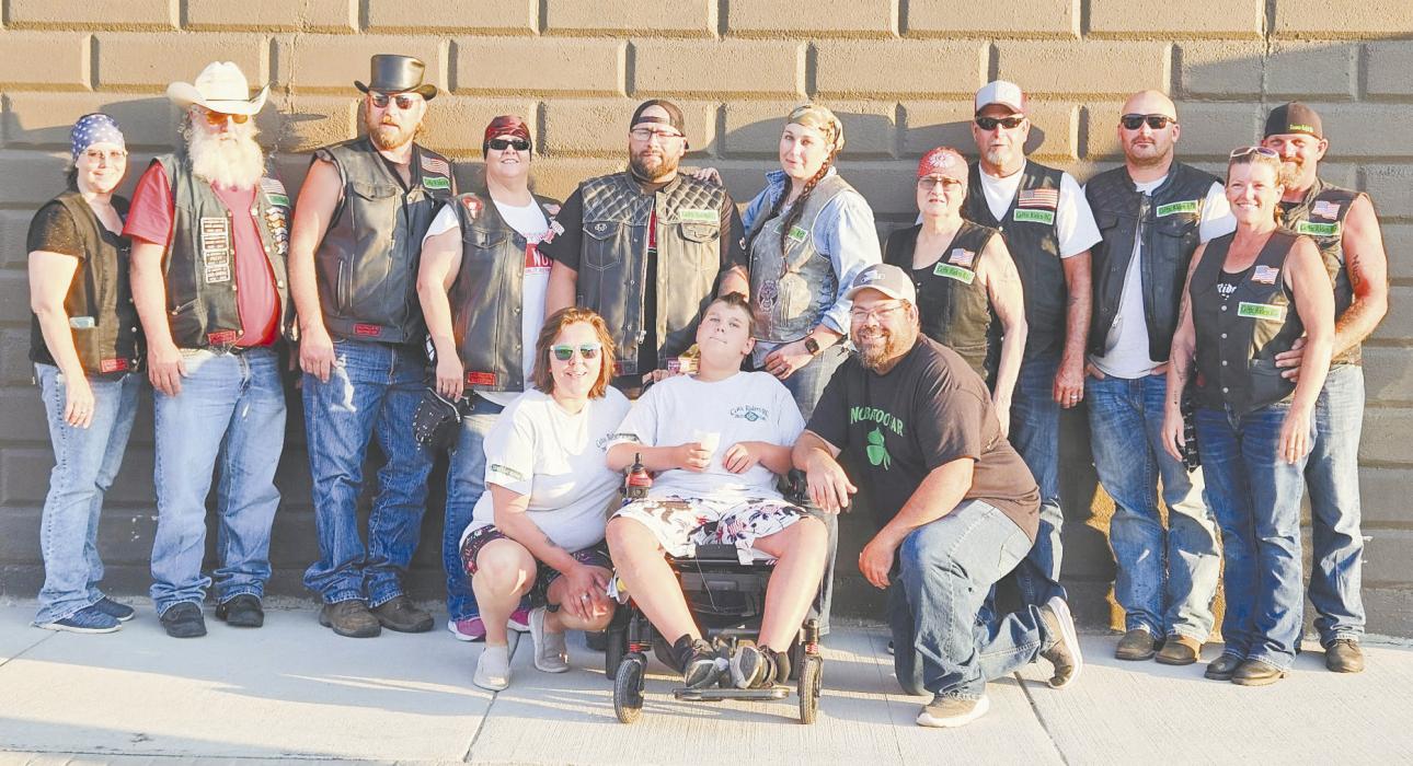A shared love of motorcycles has become something much bigger for the Celtic Riders. Following Saturday's Miles That Matter Poker Run, members gathered with this year's beneficiary, Kolter Mizner, and his family after raising $3,889 toward the purchase of a wheelchair-accessible vehicle. Back row (L-R): Kendra and Chris Osterman, Stan Daniels, Calista Wilson, Josh and Teal Reagan (Founders), Brenda and Roger Magary, Ty Shelbourn, Marti and Tony Dunbar. Front row: Julie, Kolter and Kyle Mizner.