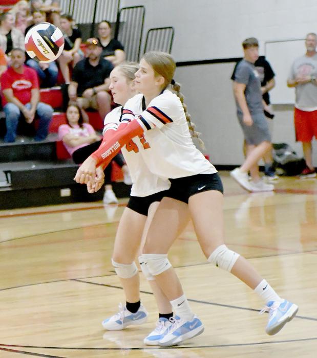 Bulldog teammates, Jaylee Good and Kinsey Walz, double up as they go after a serve. They helped to secure the victory against the North Central Lady Knights on their season opener for the 2024 season.