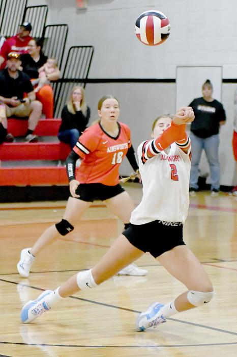 Jaylee Good goes after the serve while Ainsworth’s Libero Lily Beel is ready to assist.
