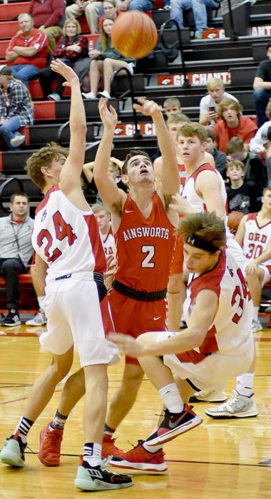 Caleb Allen drives for the basket against the Ord Chanticleers. Allen led the Dawgs with 17 points.