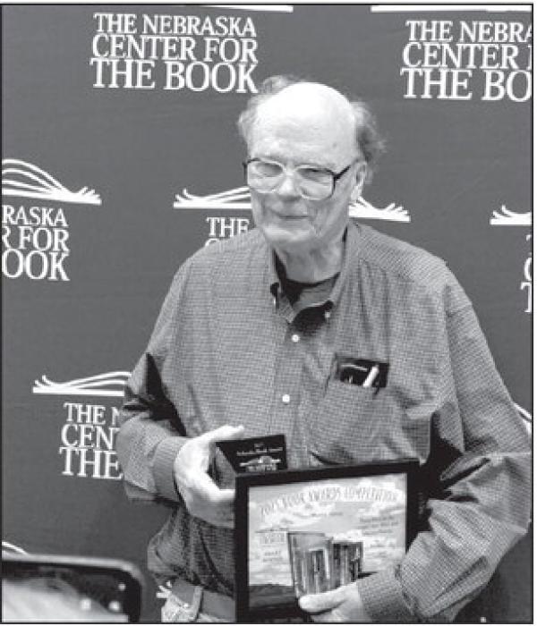 Ainsworth’s Robert Boss travelled to Lincoln to collect a plaque and certificate for winning an award with his book of poetry.