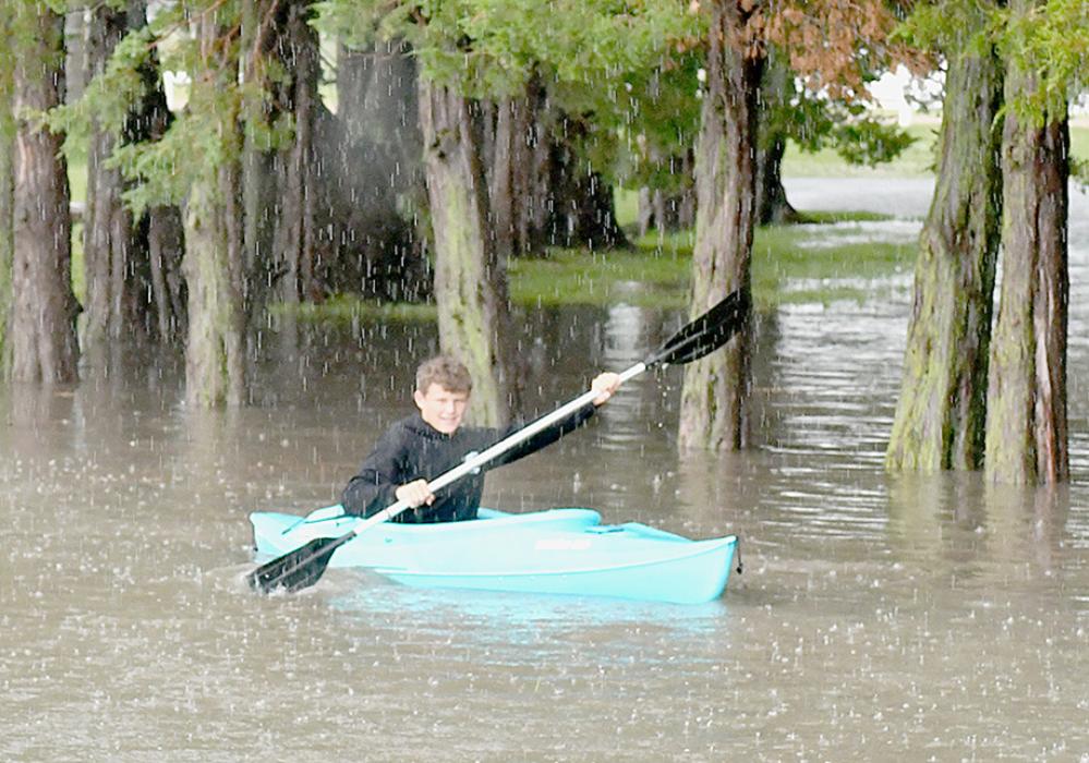 Zaine Evans got out his kayak and enjoyed the pond by the entrance to East City Park during the heavy rainfall on Thursday, June 20th.