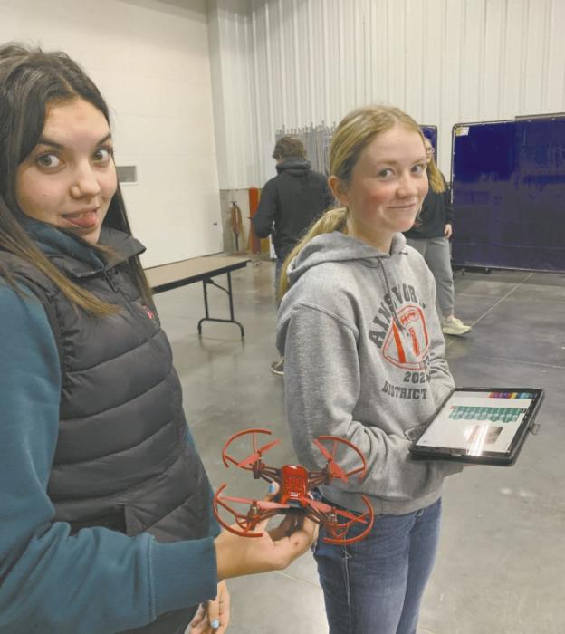 Braylin Rudnick (left) and Kenley Welke (right) learn about precision ag through drone demonstrations with Northeast Community College. Photo Courtesy of Josie Ganser, Ainsworth FFA Advisor