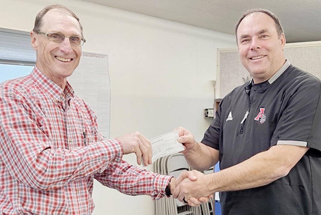 The Ainsworth Lions Club made their annual donation to the Ainsworth Food Pantry in the amount of $1,000.00. Pastor Gary Graesser (left) is pictured accepting a check from Ainsworth Lions President Dale Hafer (right).