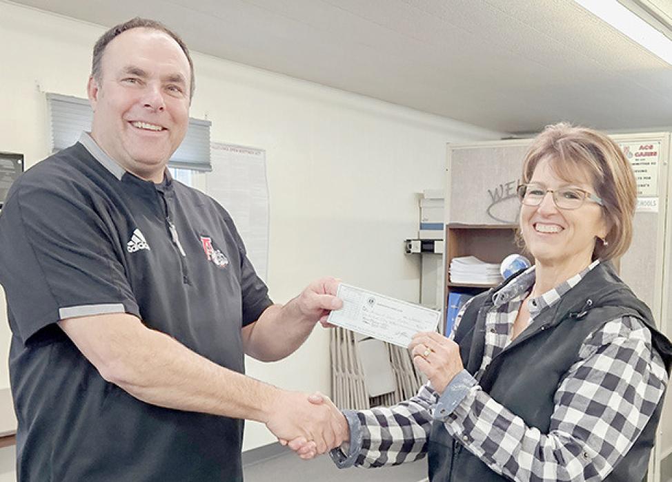 The Ainsworth Lions Club made a $250.00 donation to the Ainsworth Senior Center. Accepting the check from Ainsworth Lions Club President Dale Hafer (left) was Senior Center Director Renee Stogner (right).