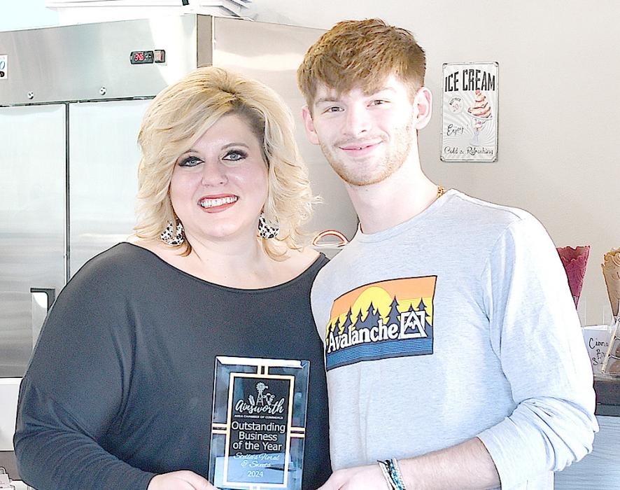 The Outstanding Business of the Year Award honors a business that contributes to the economic growth, quality of life, and practices professional conduct, community involvement, and exceptional customer service. Sheena Ferris and Ethan Arens accepted the award.