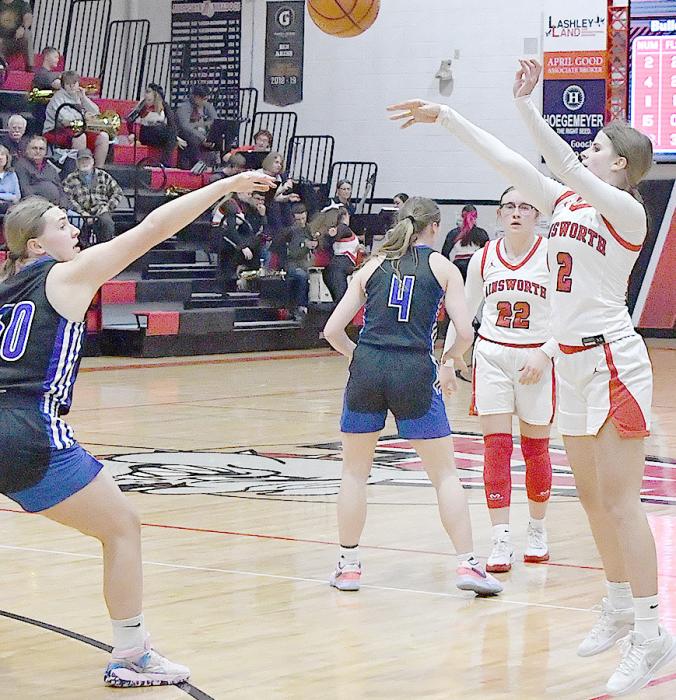 Sophomore Jaylee Good pulls up for a three point shot as O’Neill freshman Taylor Young rushes to play defense.