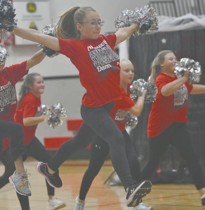 Kimberlyn Doke leaps through the air during the 10-12 year old Pom Jazz routine to ‘Defying Gravity.’