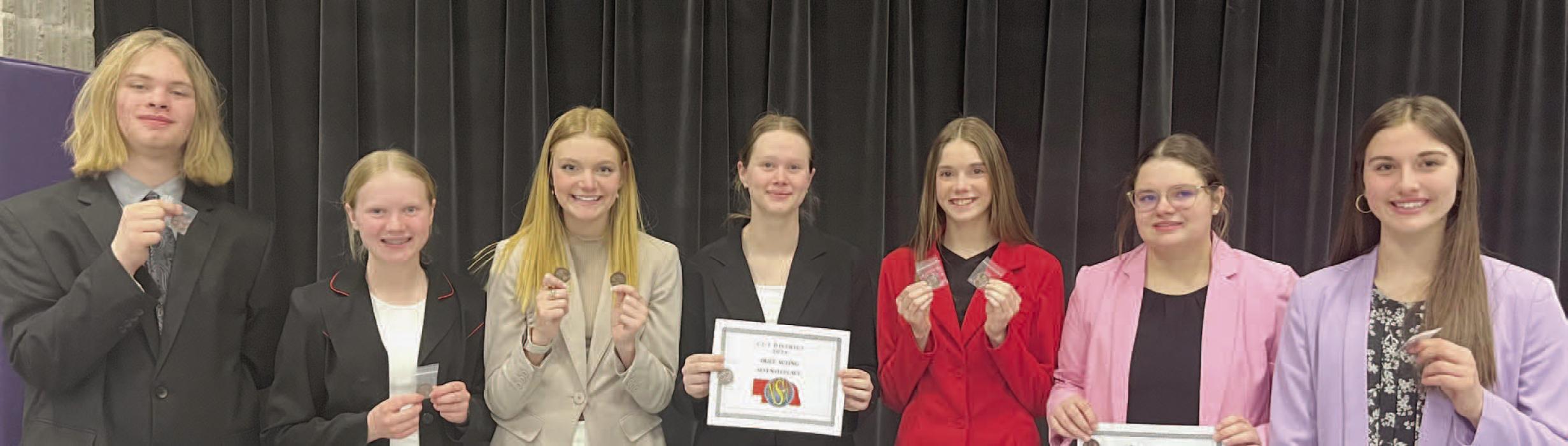 Bringing home medals from the District Speech Contest were Ainsworth students (Left to Right): Erick Hitchcock, Kiley Orton, Brianna Starkey, Puridy Haley, Taylor Allen, Hannah Beel, and Willa Flynn.