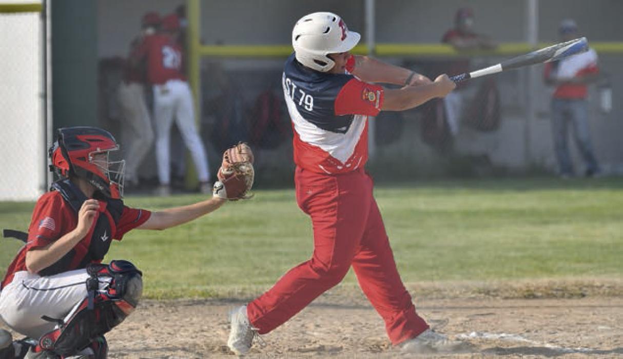 Kyle Fernandez swings at a pitch from the opposing team.