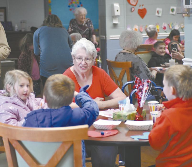Ainsworth Elementary students visited the Sandhills Care Center on Wednesday, February 11. Pictured above is the kindergarten class enjoying punch, cookies, and making keychains with the residents.