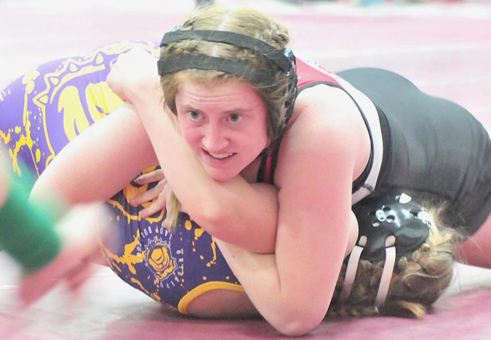 AHS junior Tatum Nickless holds down Olivia Joles of Bridgeport, who Nickless pinned in 2:45 in the consolation round at the district tournament.