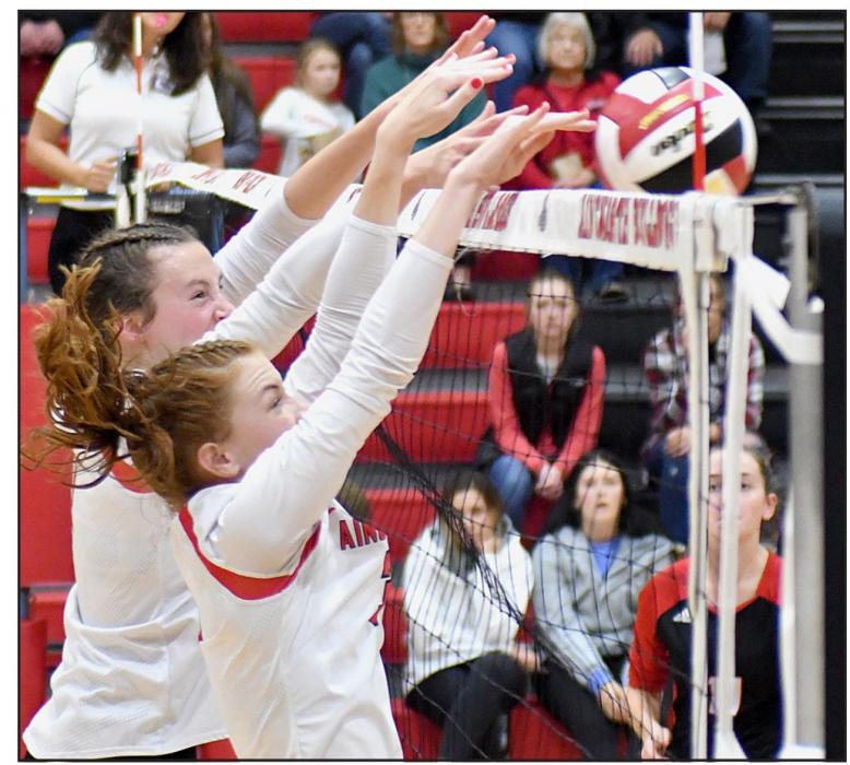 Cameryn Goochey and Eden Raymond go up for a block against the Ord Chanticleers who defeated the Bulldogs in five sets during the second round of C1-11 Subdistricts.