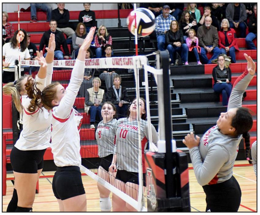 Going up for this block against the Valentine Badgers are seniors Kaitlyn Nelson and Eden Raymond.