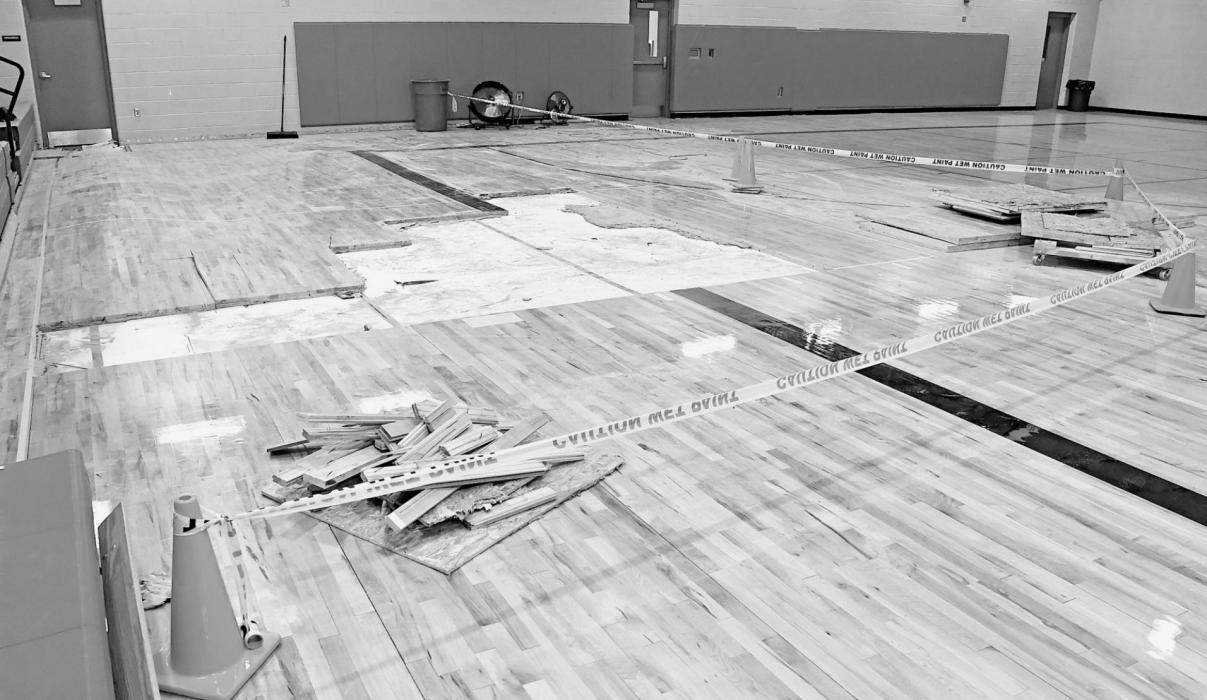 Community Center Gym Floor in Partial Removal Stage; Maple Flooring Being Laid at School