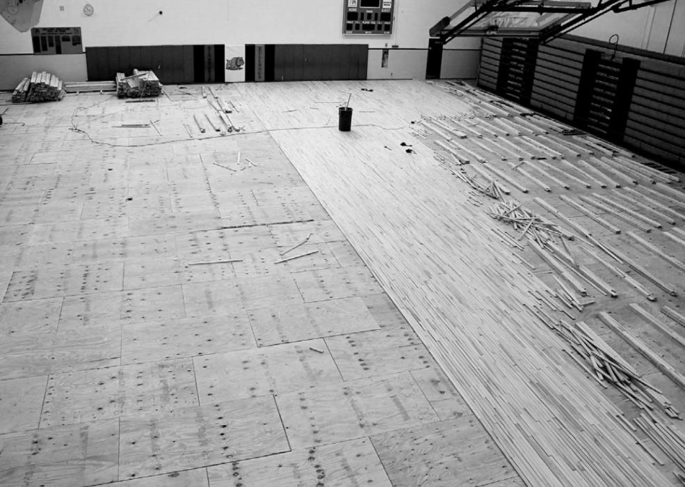 Community Center Gym Floor in Partial Removal Stage; Maple Flooring Being Laid at School