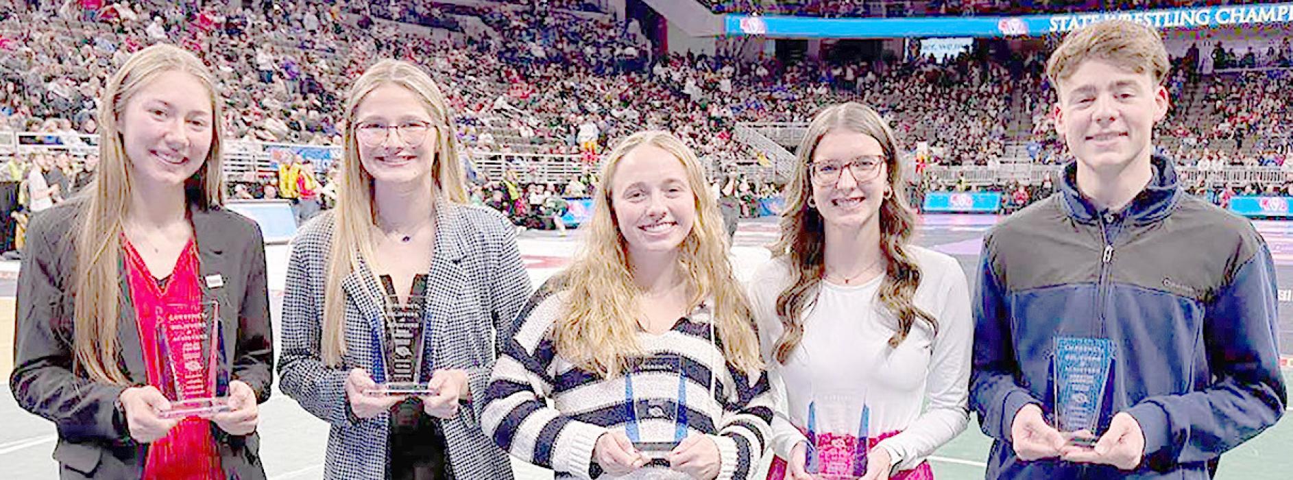 Ainsworth High School Senior Emma Kennedy (second from left) was presented her Believers &amp; Achievers award during the 2025 NSAA Boys State Wrestling Tournament. Kennedy is one of 48 statewide winners of the Believers &amp; Achievers award. Receiving their Believers &amp; Achievers awards during the state wrestling tournament were (Left to Right) Jorja Yocom of Cozad, Emma Kennedy of Ainsworth, Lucia Ambrose of Omaha Marian, Addyson Hintz of Deshler and Braxton Logeman of Omaha Burke.