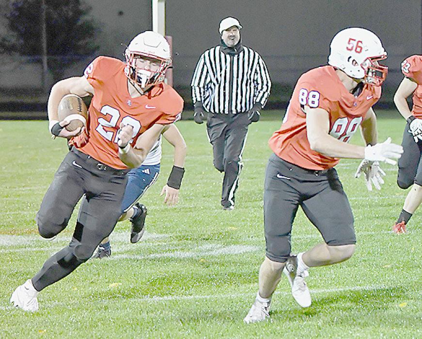 With Trey Appelt leading the way, Carter Nelson rambles for 61 yards to score Ainsworth’s second touchdown against the Boyd County Spartans.