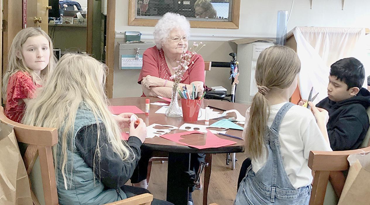 Pictured are students from the 4th Grade Class visiting and making Valentine’s Day crafts.
