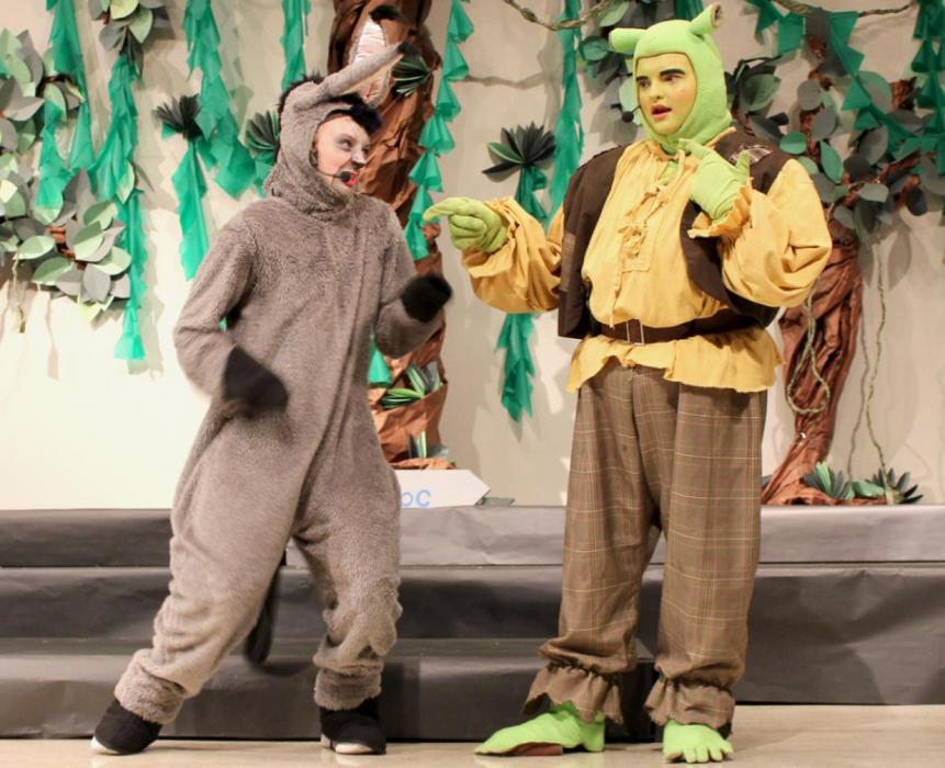 AHS junior Cameryn Goochey (left) and senior Gavin Olinger (right) perform as Donkey and Shrek the Ogre.